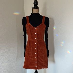 Express black puff sleeve turtleneck & burnt orange corduroy mini overall dress